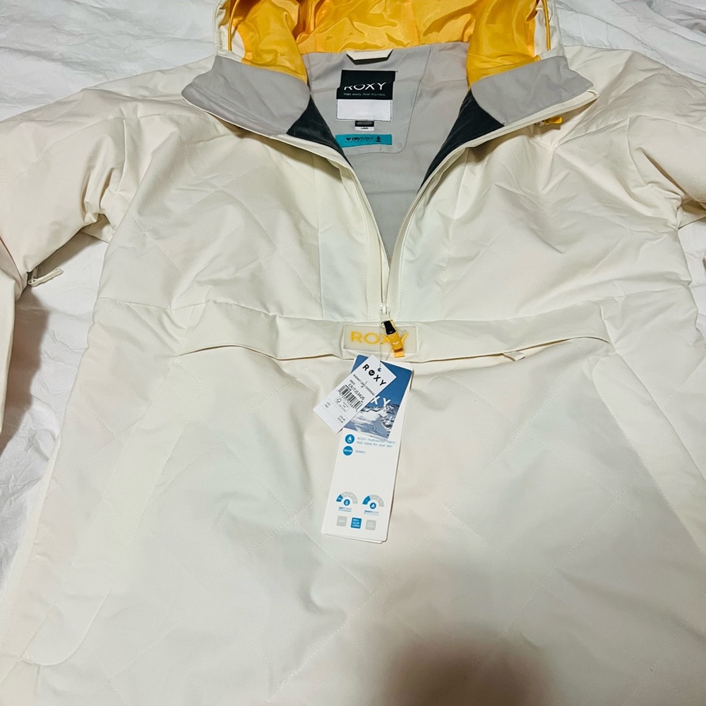 ￼ a Roxy snowboarding, jacket cream colored brand new